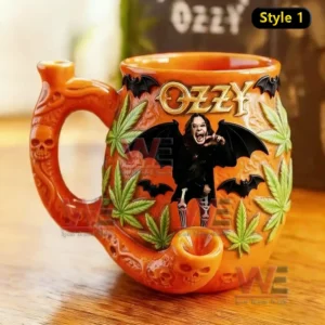 Orange gothic ceramic mug with skull pipe handle bat wings Ozzy inspired figure and leaf decorations displayed on a table!