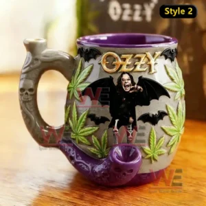 Gray purple gothic ceramic mug with skull pipe handle bat wings Ozzy inspired figure and leaf patterns on tabletop!