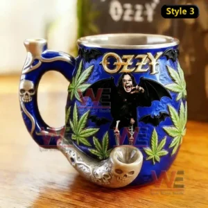Blue gothic ceramic mug with skull pipe handle bat wings Ozzy inspired figure and leaf decorations on wooden table!