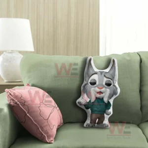 Cartoon lynx shaped pillow displayed on a green sofa in a living room!