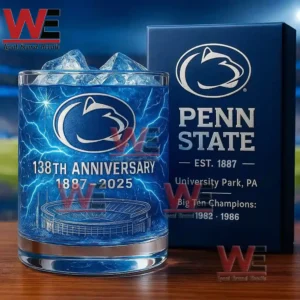 Penn State Nittany Lions 138th Anniversary 1887-2025 Whiskey Glass 7 A close up of a blue Penn State anniversary glass and box set with vivid lighting and a stadium background!
