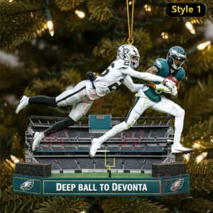 Hanging Philadelphia Eagles ornament showing a green uniform player catching a deep pass while a white uniform defender dives behind him above a stadium base labeled Deep Ball To Devonta!
