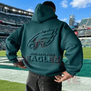 Back view of a green Philadelphia Eagles hoodie with embossed logo worn on a football field!