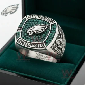 Philadelphia Eagles fan ring with green gemstone face silver band and eagle emblem symbolizing strength passion and football dedication!