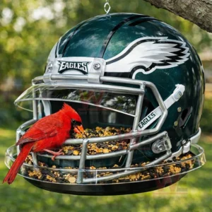 Philadelphia Eagles Helmet Bird Feeder 3 Hanging football helmet bird feeder with a red bird eating seeds outdoors!