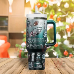 Green Eagles themed insulated tumbler standing upright on a wooden surface with football graphics and championship celebration design!