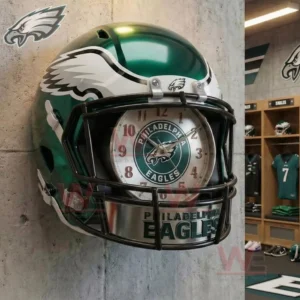 Green Philadelphia Eagles helmet wall clock with a black face mask framing a clock face that shows the Eagles logo mounted on a wall near a locker room!