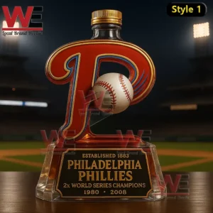Collectible whiskey bottle in the shape of a red letter P with a baseball at the center standing on a clear base inside a baseball stadium setting!