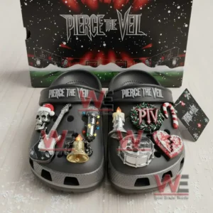 Dark clogs with various themed charms displayed in front of a Pierce the Veil box on a light surface!