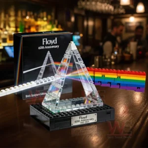 Pink Floyd 60Th Anniversary 2025 Prism Brick Building Block Set 3 Prism brick sculpture with rainbow light effect displayed on a bar counter with a warm background setting!