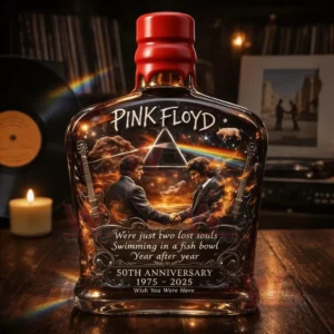 Pink Floyd inspired whiskey bottle on a table with candle light vinyl records and a cozy listening room setting!