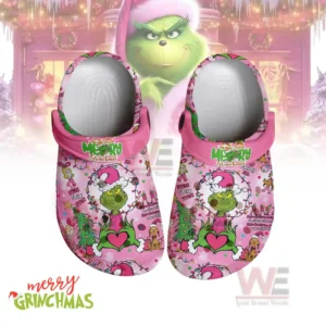 Pink Grinch themed clogs displayed against a soft festive background!