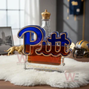Pittsburgh Panthers Hail To Pitt Custom Whiskey Bottle 5 A Pitt bottle with a crown cap on white fur with Pitt memorabilia in the background.