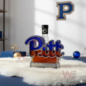 Pittsburgh Panthers Limited Edition Whiskey Bottle 4 A Pitt logo bottle with a black cap placed on a rug in a bright room with blue and gold accents!