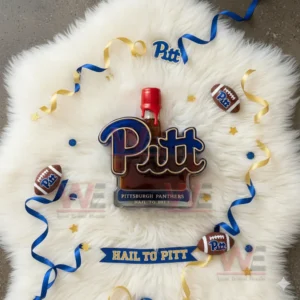 Pittsburgh Panthers Limited Edition Whiskey Bottle 5 A top view of a Pitt logo bottle with a red cap surrounded by decorative ribbons and small footballs on a white rug!
