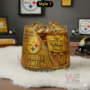 Pittsburgh Steelers Champions Whiskey Glass 4 Golden themed Pittsburgh Steelers glass with amber iced drink featuring terrible towel artwork in a fan decorated room!