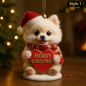 Light colored puppy in Santa hat and scarf holding a red Merry Christmas heart ornament indoors with warm festive lights!