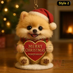 Golden puppy in Santa hat and plaid scarf holding a Merry Christmas Pomeranian heart ornament indoors with warm festive lighting!