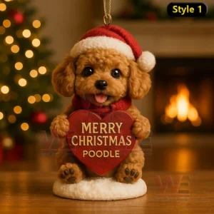 Brown poodle ornament holding a Merry Christmas Poodle heart sign with warm lights and a fireplace in the background!