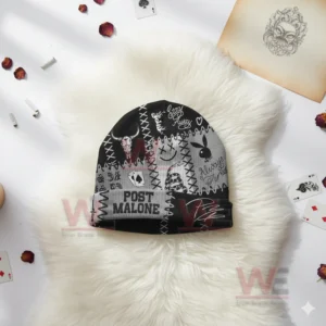Black and grey Post Malone beanie with tattoo style graphics on white furry surface.