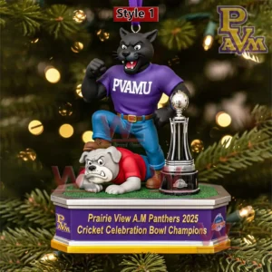 A black panther mascot ornament in purple attire stands on a base with a trophy nearby set against a glowing holiday tree background!