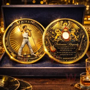 Gold commemorative Queen coin set with a singer performing on stage and a detailed musical emblem design presented in a premium display box!