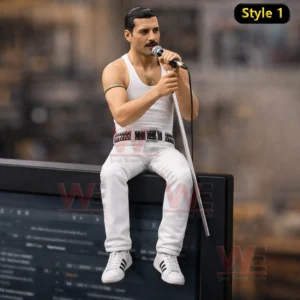 Singer figure with microphone seated on a speaker wearing a white outfit in a music themed display!