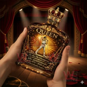 Queen We Are The Champions 53Rd Anniversary 1973-2026 Whiskey Bottle 4 Hands holding a Queen themed whiskey bottle with crown cap featuring a singer illustration golden rays and 53rd anniversary 1973 2026 text with a theater stage backdrop.