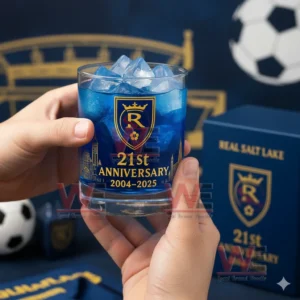 Blue Real Salt Lake anniversary whiskey glass with ice held by hands in a soccer inspired setting!