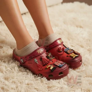 Reba McEntire Crocs Clogs with Charms 4 Feet wearing red glitter country music themed clogs on a plush indoor carpet!