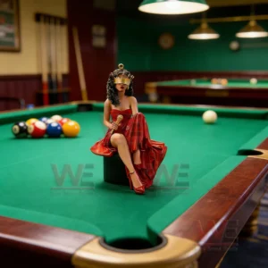 Female singer figurine in a red gown holding a microphone while sitting on a pool table with billiard balls in the background!
