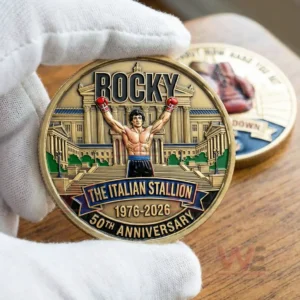 Hand holding a Rocky anniversary coin with clear front design!