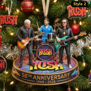 A detailed ornament of three musicians performing together displayed among Christmas tree branches and shiny holiday decor!
