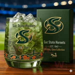 A green iced Sac State Hornets glass positioned next to its matching collection box on a wooden table!
