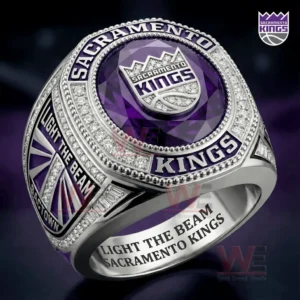 A close up view of a Sacramento Kings ring with a purple gem center silver metal band and intricate detailing!