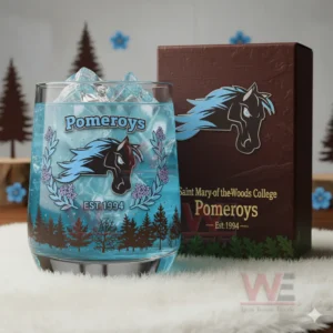 A blue Pomeroys glass with ice displayed on a white fluffy surface with forest themed decor behind it!