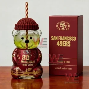 Red and gold bear glass cup with team themed box displayed on a wooden surface!