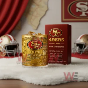 San Francisco 49ers golden anniversary glass with amber iced drink beside a red box showing team emblem and celebration details!