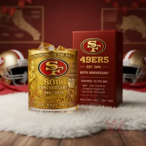 San Francisco 49ers 80th Anniversary 1946-2026 Faithful To The Bay Whiskey Glass 5 San Francisco 49ers golden anniversary glass with amber iced drink beside a red box in a football themed room!