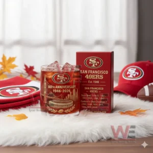 A San Francisco Forty Niners anniversary glass filled with ice next to a decorated team box surrounded by themed accessories!