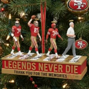 A group of miniature 49ers legends displayed on a commemorative stand ornament hanging among decorated Christmas tree branches!