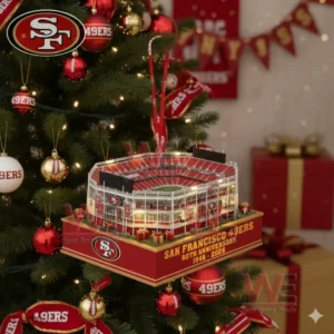San Francisco football stadium ornament hanging on a Christmas tree with red and gold decorations and glowing holiday lights!