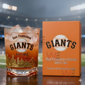 San Francisco Giants whiskey glass with ice next to an orange collector box on a table in a stadium environment!