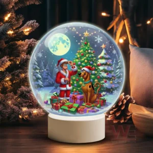 A snow globe showing a Santa dressed character with Scooby Doo surrounded by gifts under a decorated Christmas tree on a snowy night!