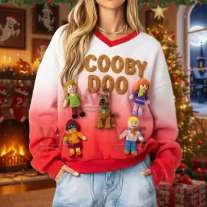 Person wearing a Scooby Doo crochet v neck sweatshirt with red and white colors posed in front of a Christmas tree indoors!