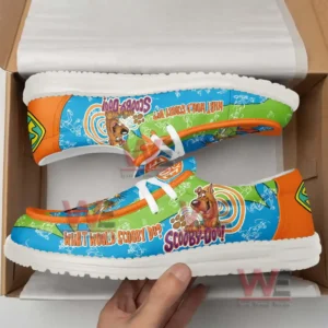 Scooby Doo themed colorful shoes inside an open box with a hand lifting one shoe!