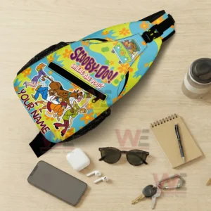 Scooby Doo Where Are You Personalized Sling Bags 7 Top down view of a cartoon sling bag on a table with phone sunglasses earbuds notebook keys and drink!