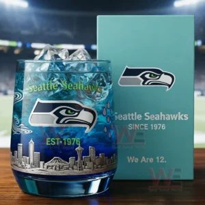 Seattle Seahawks themed glass with ice blue drink team logo and skyline design next to a branded box!