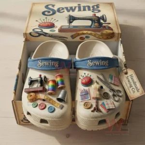 Light clogs inside a craft themed box decorated with sewing machine thread spools scissors buttons and measuring tools!