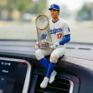 Dodgers baseball player figurine sitting on a car dashboard holding a championship trophy!